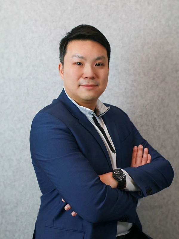 A professional portrait of  Humphrey Ho, Chairman and President at Helios Worldwide