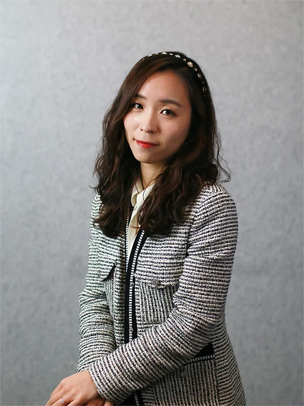 A professional portrait of Tori Oh, Managing Director at Helios Worldwide