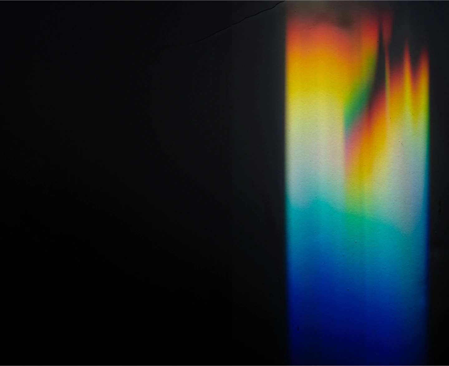 Helios Worldwide's five-step process for digital experience design, including Immersion, Strategy, Experience, and Production, visualized with a creative light prism effect